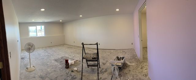 Freshly hung and finished drywall in a basement remodel