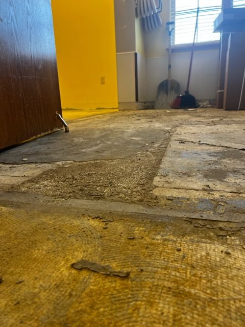 Damaged subfloor before replacement at the day care